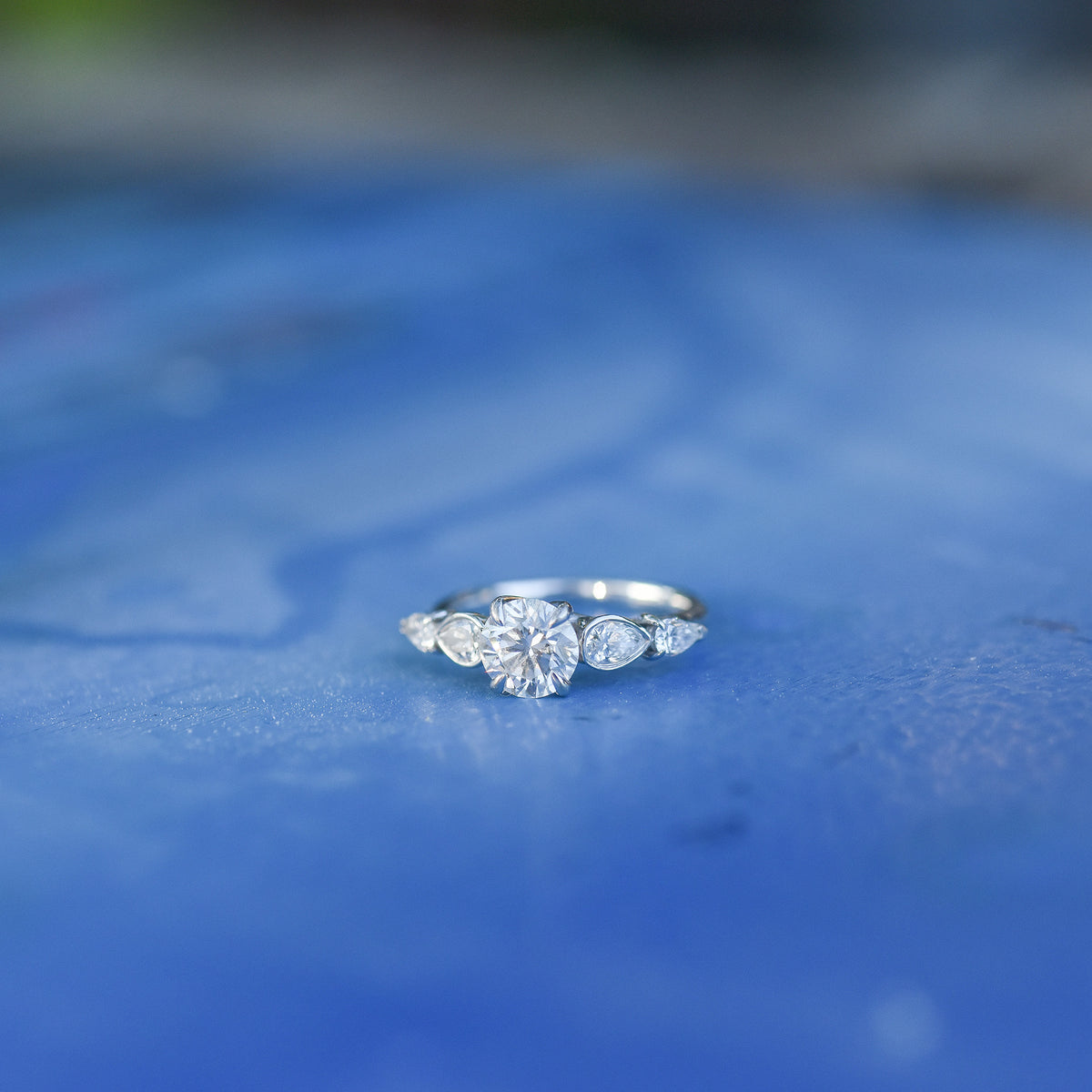 CELESTE diamond ring with round center and four pear-shaped side diamonds