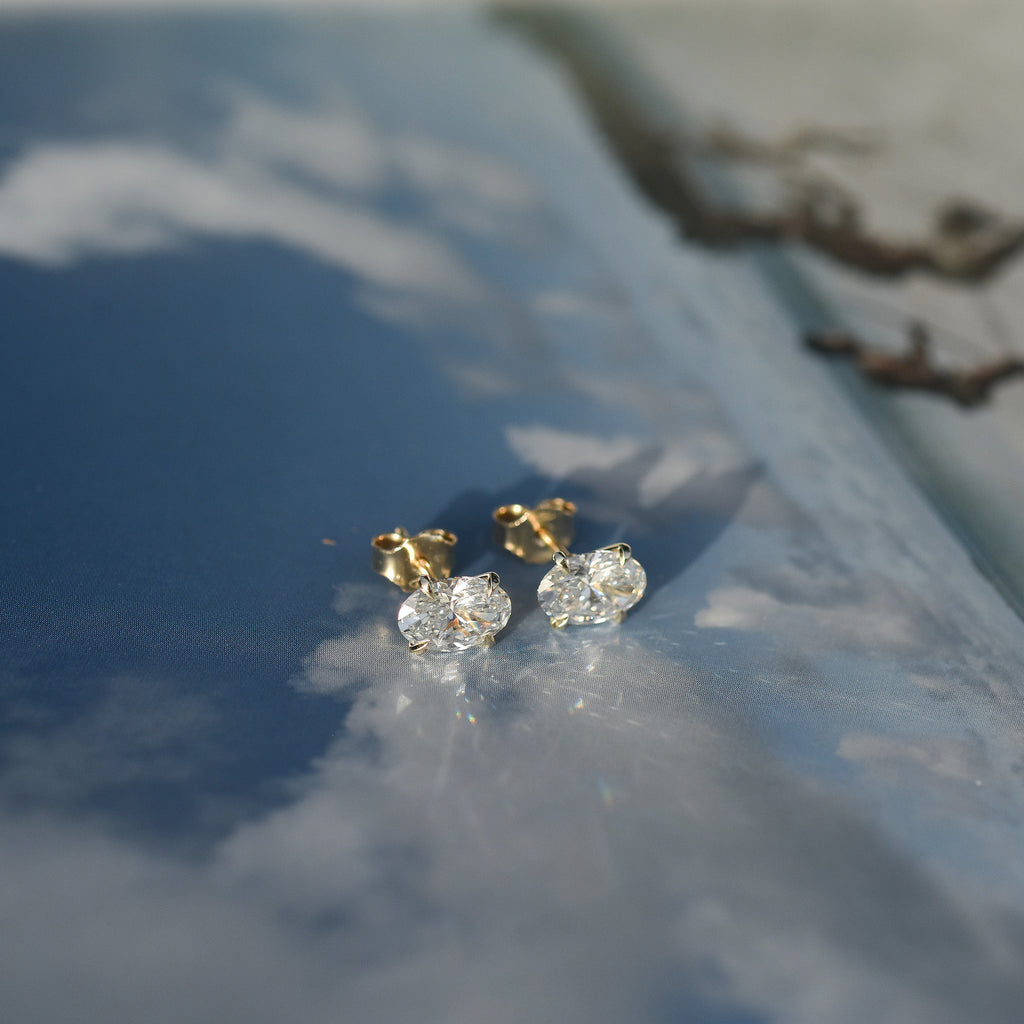SOLENNE oval-cut diamond stud earrings in yellow gold, photograph 1