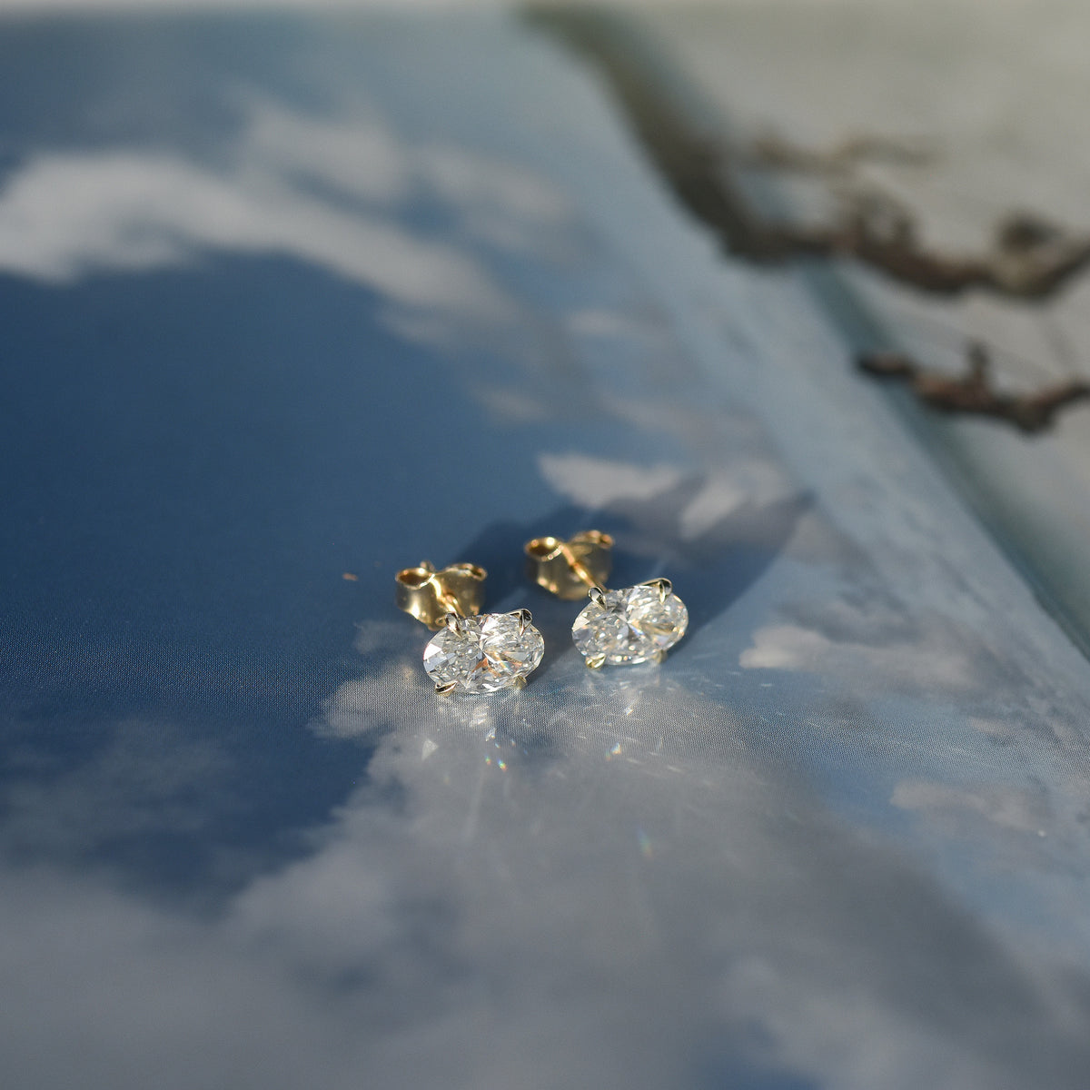 SOLENNE oval-cut diamond stud earrings in yellow gold, photograph 1
