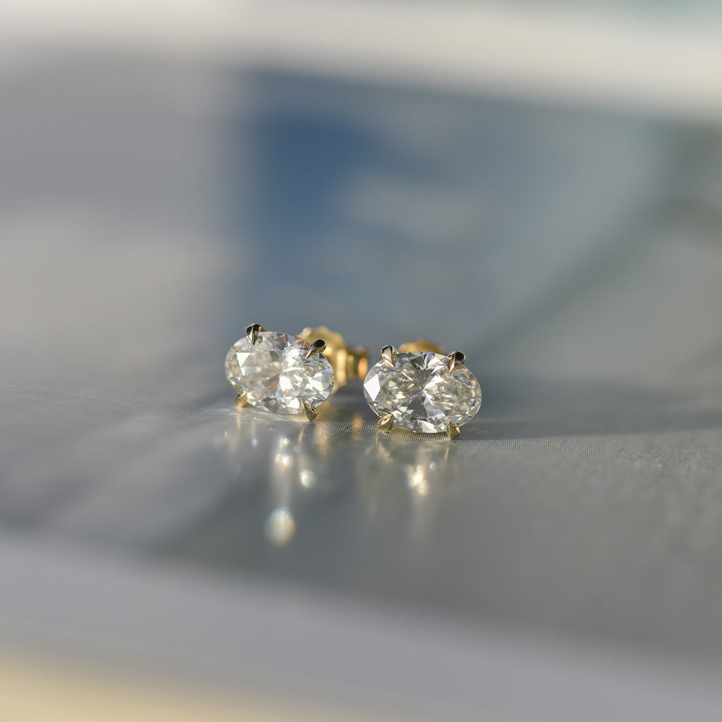 SOLENNE oval-cut diamond stud earrings in yellow gold, photograph 3