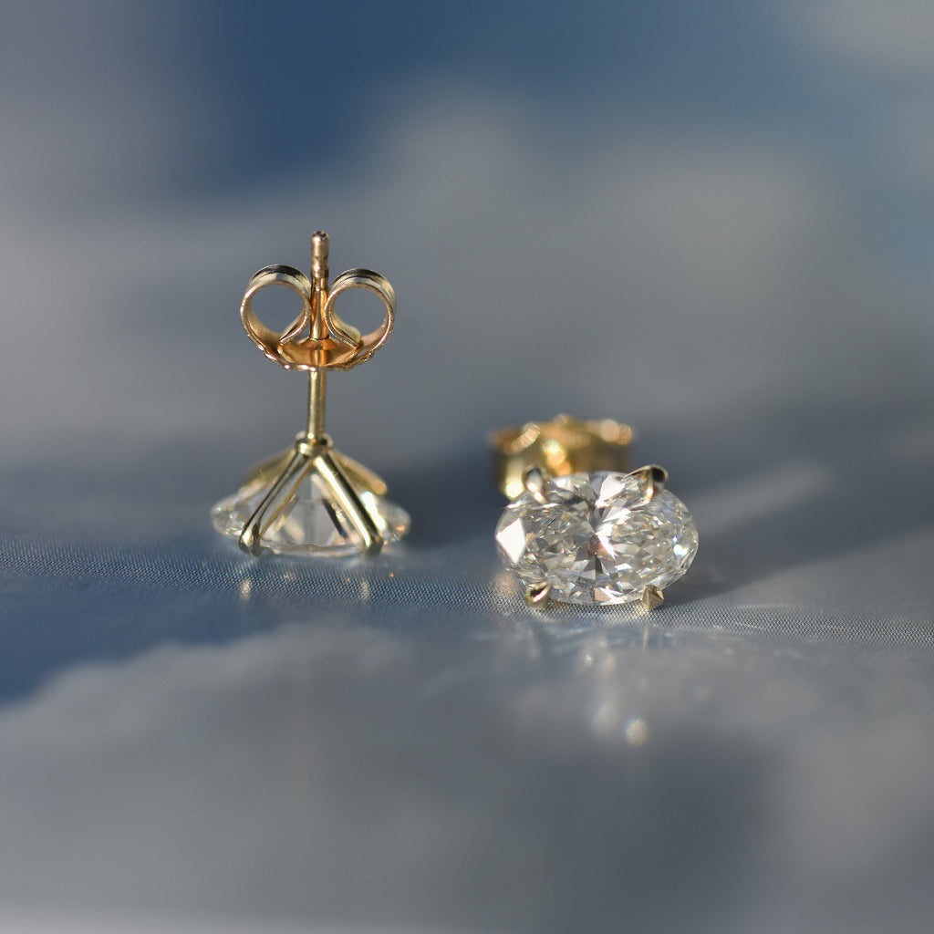 SOLENNE oval-cut diamond stud earrings in yellow gold, photograph 4