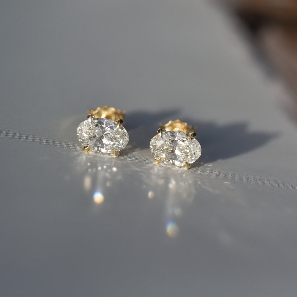 SOLENNE oval-cut diamond stud earrings in yellow gold, photograph 5