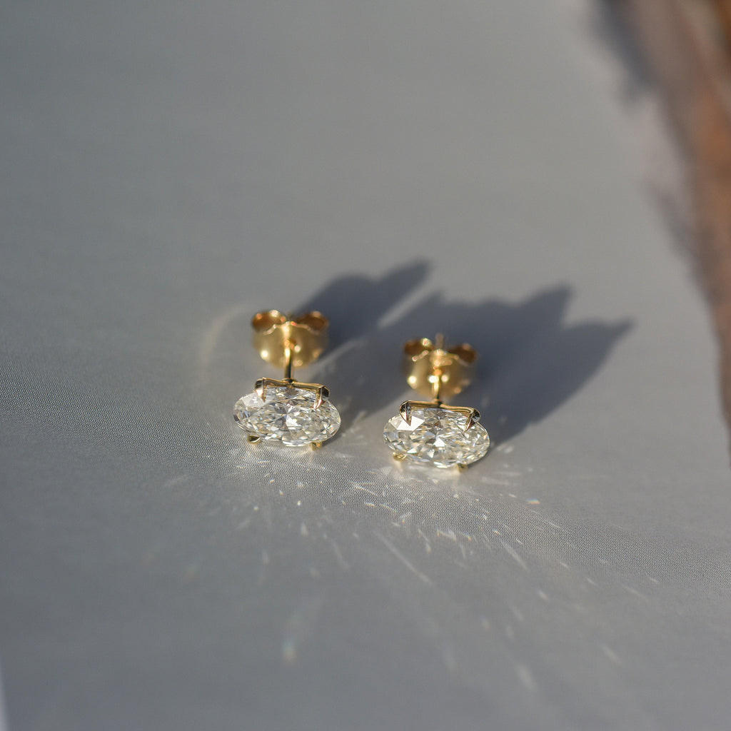 SOLENNE oval-cut diamond stud earrings in yellow gold, photograph 6