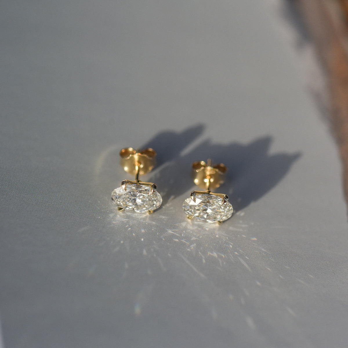 SOLENNE oval-cut diamond stud earrings in yellow gold, photograph 6